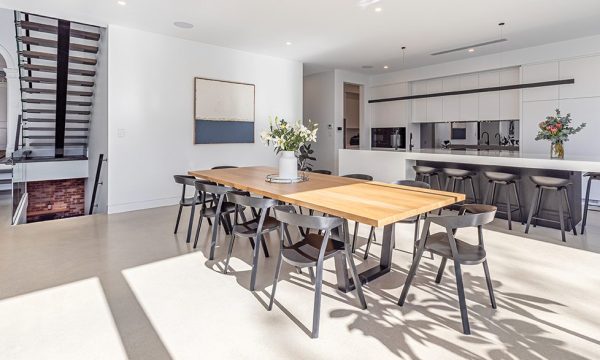 The sense of light and space is clear, looking back through the open plan area to the front door. The butler’s pantry is to the left of the kitchen, the powder room is to the right and the basement area is accessed via stairs from this zone. Photograph Robyn Bradman, Logic Films Australia