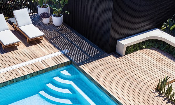 Beautiful use of concrete, timber and texture can be seen in the stunning pool design.