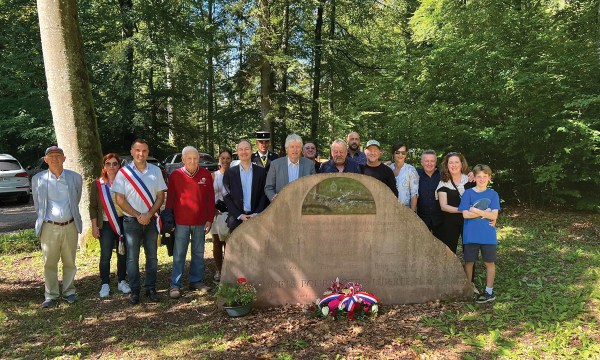 Journalist Genevieve Meegan, second from right, with her family and members of the Montbronn community who built this memorial to honour those who died here in WWII, including Genevieve's uncle John Wilkinson. 