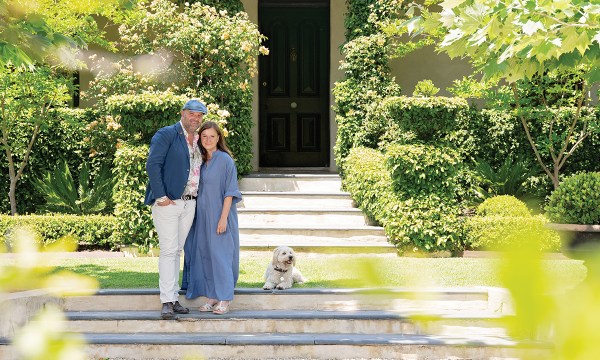 Susie and Andrew, pictured with dog Arthur, have spent more than 25 years creating their beautiful family home next to their Bird in Hand winery.