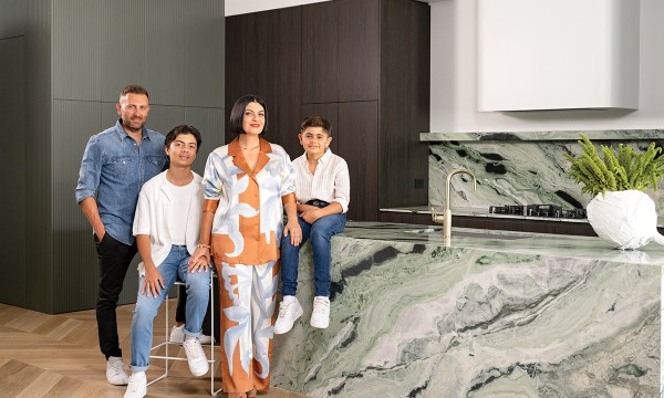 Nic, Jacob, Mirella (wearing Sir The Label) and Santiago in their beautiful kitchen. Stools by Adelaide firm Agostino and Brown and white vessel from Floristry by Sally Wotton.