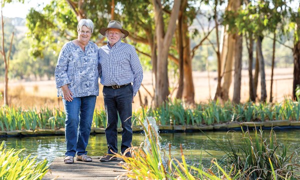While most people slow down in retirement, Sue and Jim, now aged 70 and 72, got to work transforming a bare property into a sprawling oasis in just a decade.