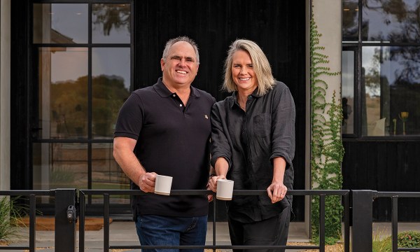 Rob and Marnie outside the main home on the property where the family lives.