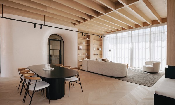 The Venetian plastered, curved archway that delineates the transition from the old villa into the new addition is one of the stunning heroes of the renovation. The floors have been completed in chevron pattern in Graupa.