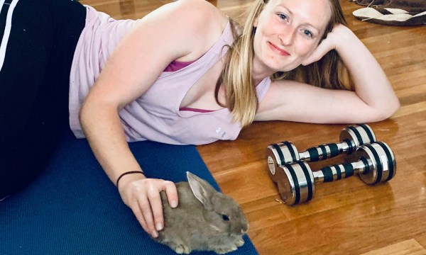 Rianna Cash at home in Okinawa, with rabbit PeeDee.