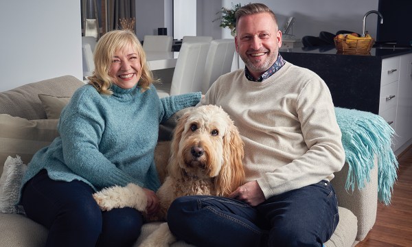 The couple photographed with their beloved groodle Ted who provides “all the love and connectivity and play that we could actually need”.