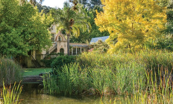 Looking back across the small lake at the house gives a sense of the space and style of this beautiful property.