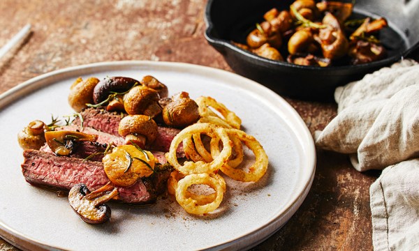 Thumbnail for Recipe: Flank steak with roasted mushrooms, onion rings & miso butter