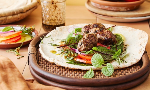 Thumbnail for Recipe: Lamb shoulder sausages and tomatoes with sumac dressing